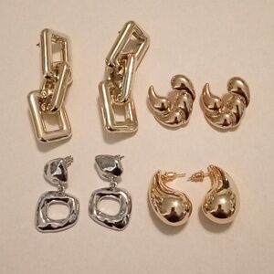 #1043.  4 Piece Assorted Silver And Gold Toned Earring Bundle.